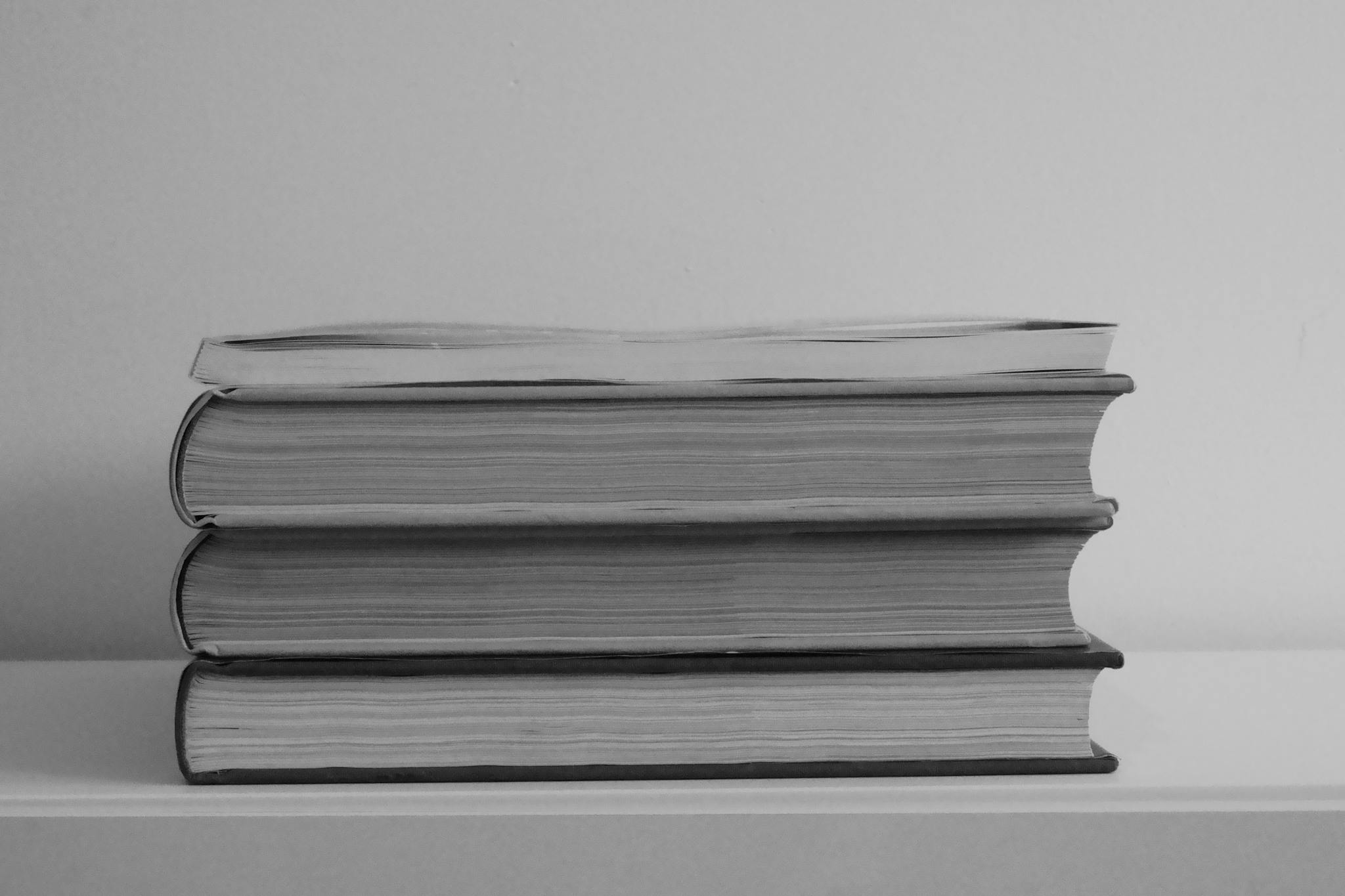 Stack of Books on White Table